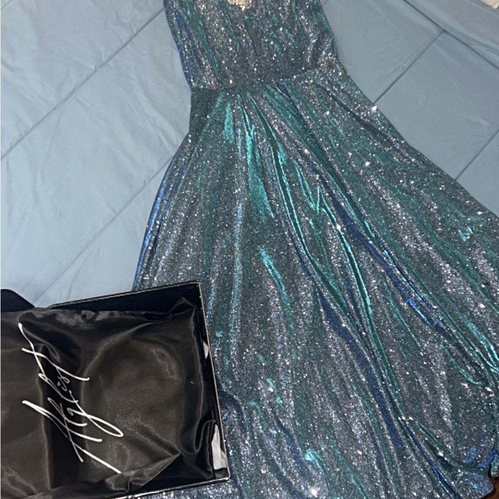 Hadi gown. Mixture of blues. Beautiful dress. Size extra small.